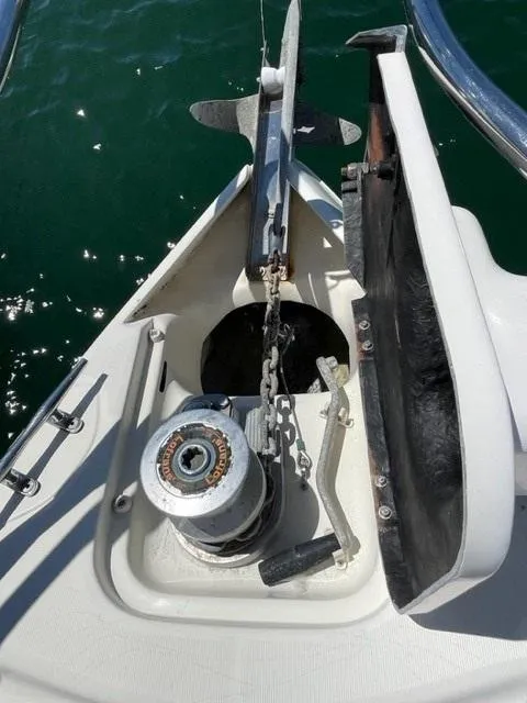 Slide: The Image of Anchor system on 2005 Cranchi 33 Express boat, featuring a winch and chain mechanism. - 22