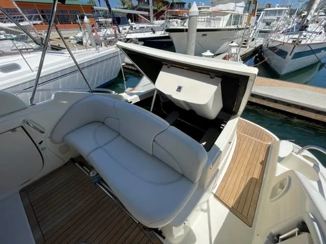 Slide: The Image of 2005 Cranchi 33 Express yacht with open storage, docked at marina. - 24