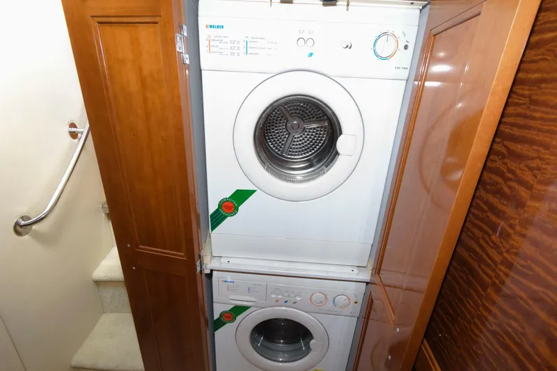 Slide: The Image of Stacked washer and dryer in 2003 Carver 450 Voyager Pilothouse yacht. - 14