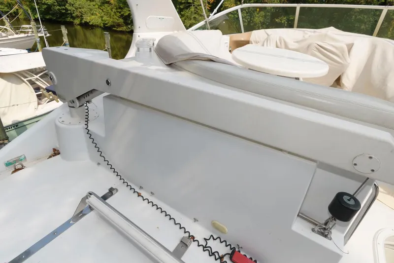 Slide: The Image of 2003 Carver 450 Voyager Pilothouse yacht deck with seating and table. - 15