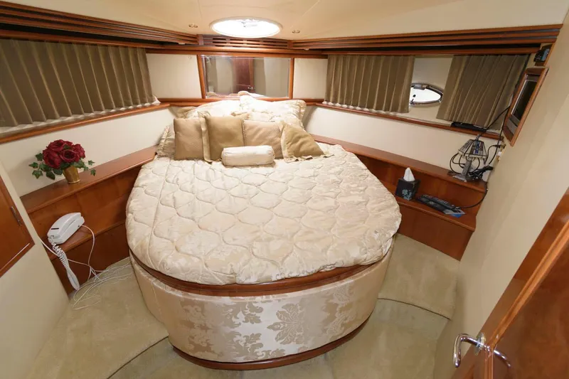 Slide: The Image of Luxurious bedroom in 2003 Carver 450 Voyager Pilothouse yacht with plush bedding. - 12
