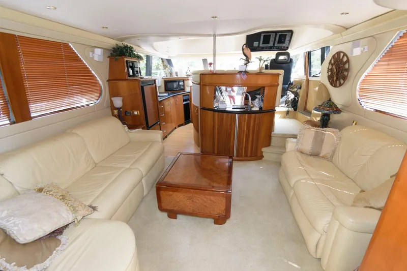 Slide: The Image of Luxurious interior of a 2003 Carver 450 Voyager Pilothouse yacht with leather seating. - 5