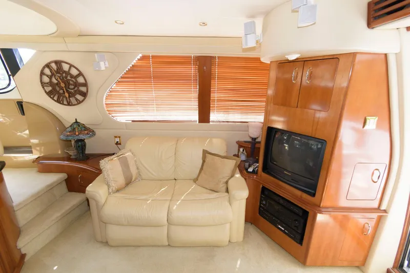 Slide: The Image of Luxurious interior of 2003 Carver 450 Voyager Pilothouse with leather sofa and entertainment center. - 7