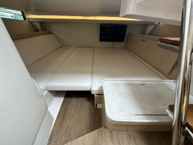 Slide: The Image of Interior cabin of 2024 Regal 38SAV boat with modern furnishings and wood flooring. - 10