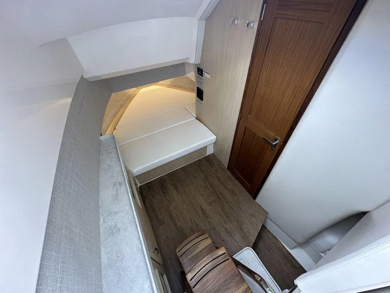 Slide: The Image of 2024 Regal 38SAV cabin interior with wooden flooring and modern furnishings. - 12