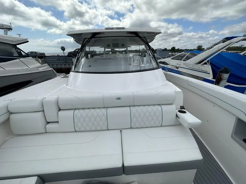 Slide: The Image of 2024 Regal 38SAV boat with white seating and sleek design. - 13