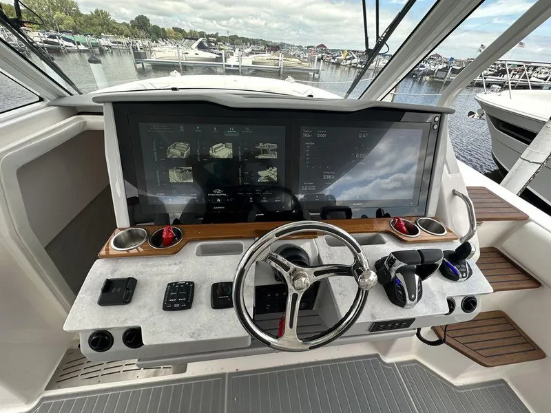 Slide: The Image of 2024 Regal 38SAV boat helm with advanced navigation system and controls. - 8