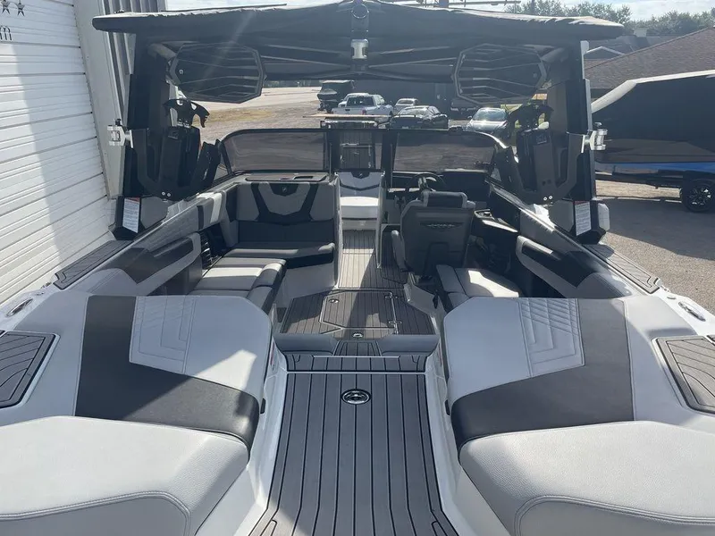 Slide: The Image of 2022 Nautique Super Air Nautique G23 interior with spacious seating and modern design. - 4