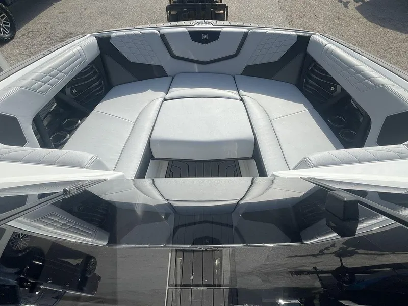 Slide: The Image of 2022 Nautique Super Air Nautique G23 boat interior with luxurious seating. - 6