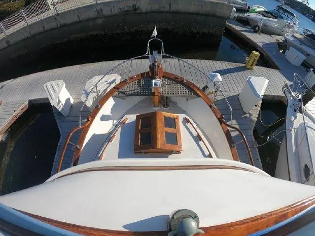 Slide: The Image of 1977 CHB 34 Double Cabin boat docked at a marina. - 15
