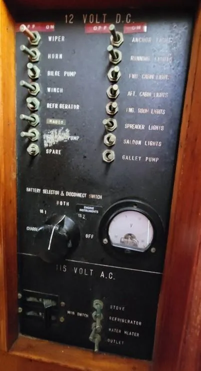 Slide: The Image of 1977 CHB 34 Double Cabin electrical control panel with switches and voltmeter. - 26