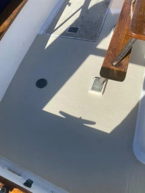 Slide: The Image of 1977 CHB 34 Double Cabin boat deck with wooden trim and hatch. - 39