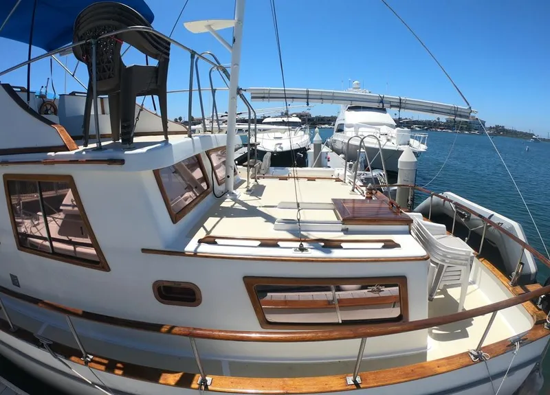 Slide: The Image of 1977 CHB 34 Double Cabin yacht docked at marina with other boats. - 4