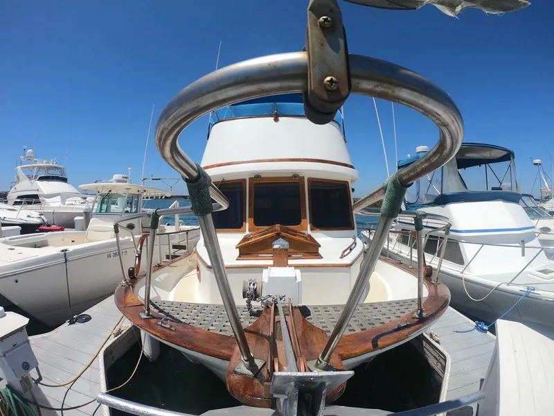 Slide: The Image of 1977 CHB 34 Double Cabin yacht docked at marina on a sunny day. - 6