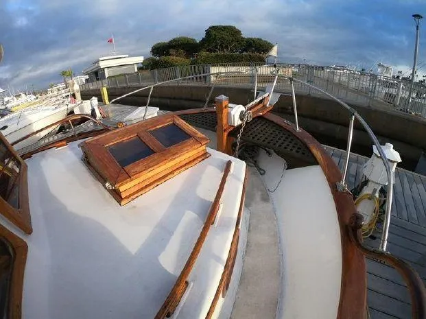 Slide: The Image of 1977 CHB 34 Double Cabin boat docked at a marina. - 7