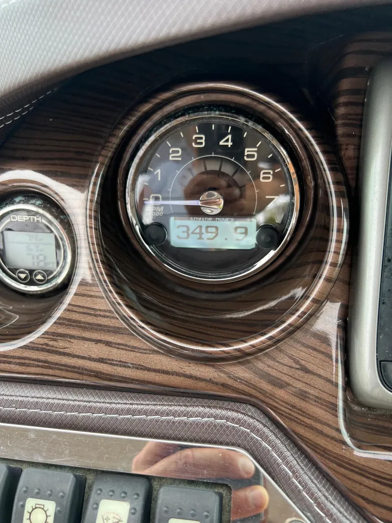 Slide: The Image of Close-up of 2015 Monterey 268 SC boat dashboard with gauges. - 18
