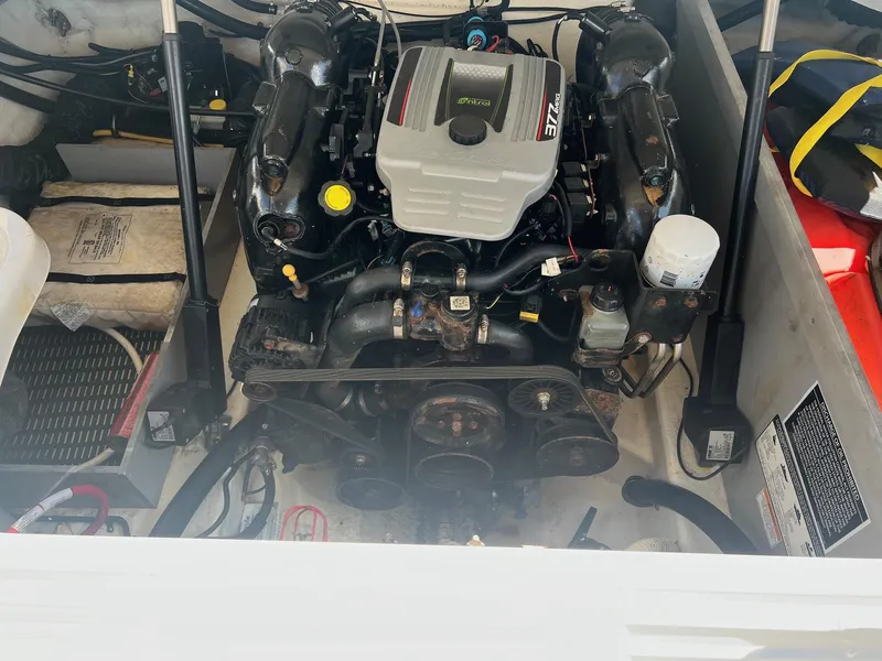 Slide: The Image of 2015 Monterey 268 SC boat engine compartment with visible engine components. - 26