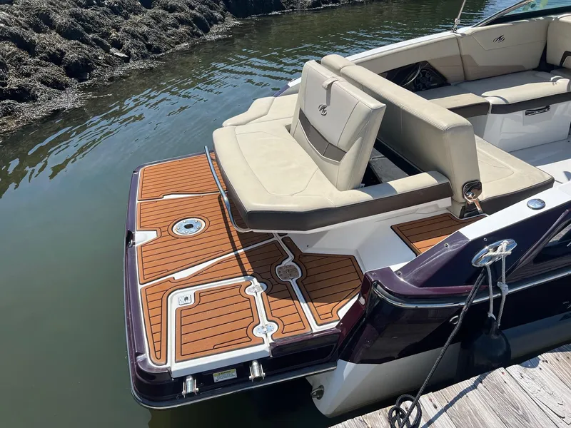 Slide: The Image of 2015 Monterey 268 SC boat with teak deck and cushioned seating. - 4