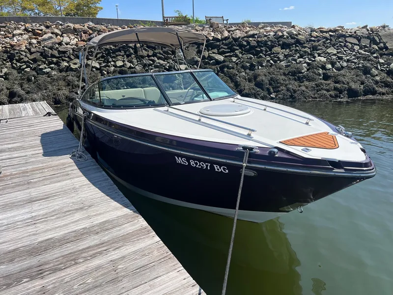 Slide: The Image of 2015 Monterey 268 SC boat docked by a wooden pier. - 9