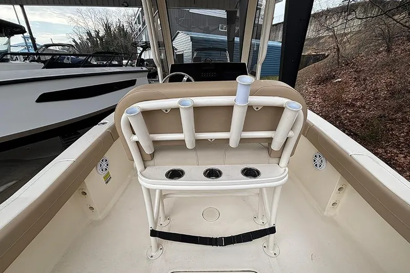 Slide: The Image of 2024 Scout 215 XSF boat interior with rod holders and seating. - 12