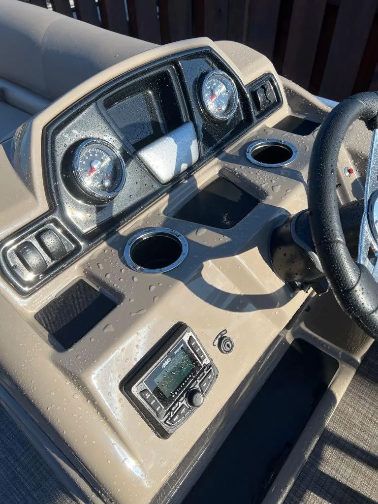 Slide: The Image of 2024 Ranger Reata 200C boat dashboard with gauges and controls. - 5