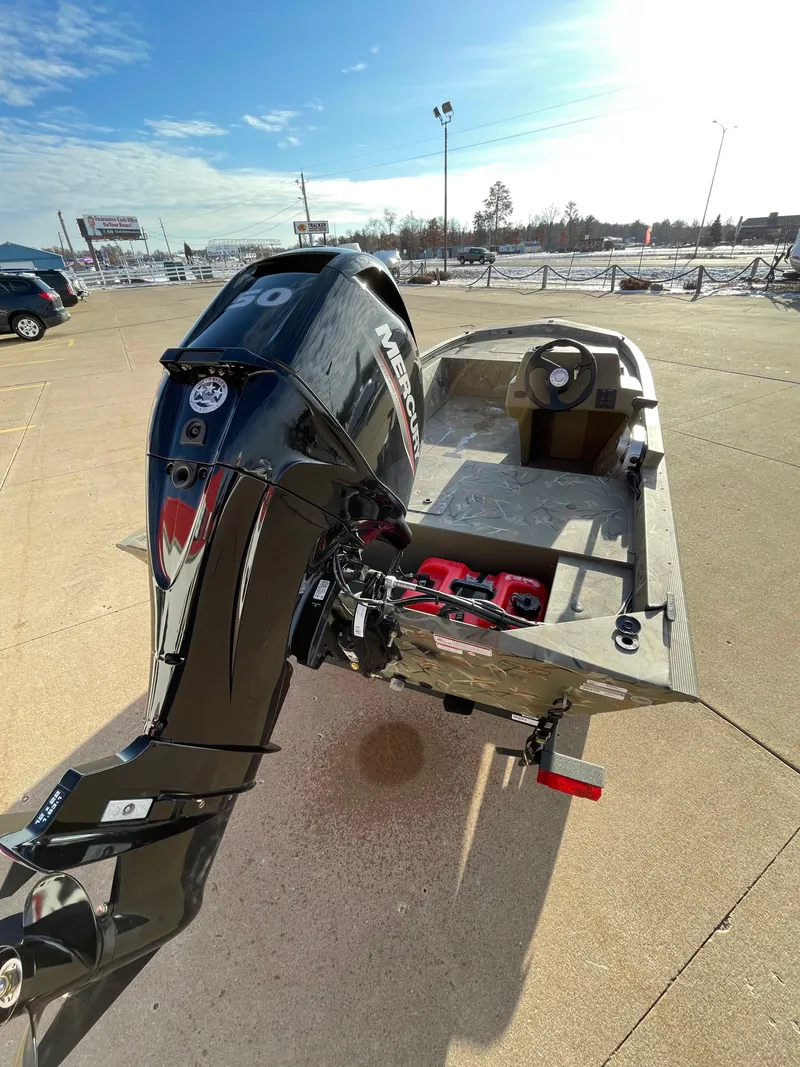 Slide: The Image of 2024 Tracker Grizzly 1648 SC boat with Mercury outboard motor. - 2