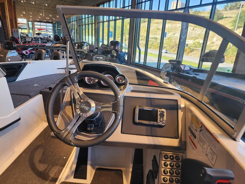 Slide: The Image of 2024 Ranger 1850MS boat interior with steering wheel and dashboard controls. - 6