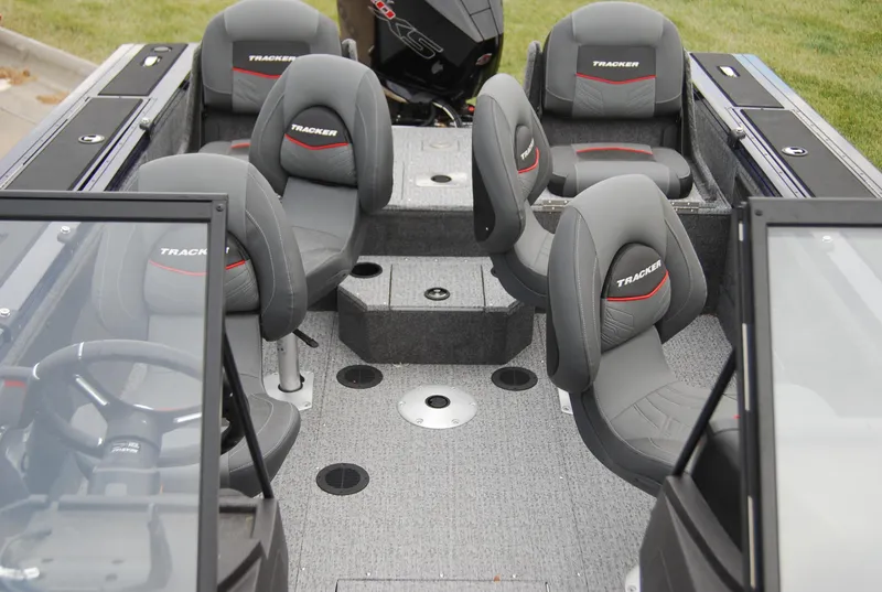Slide: The Image of 2024 Tracker Targa V-19 Combo boat interior with seating and console. - 5