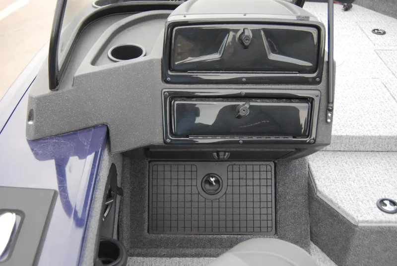 Slide: The Image of 2024 Tracker Targa V-19 Combo boat dashboard with storage compartments. - 6