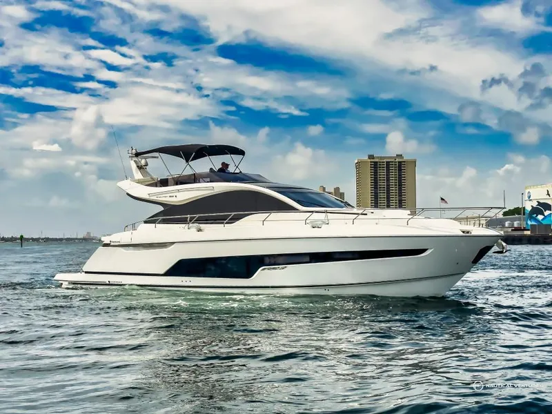 The Image of 2023 Fairline Phantom 65 luxury yacht cruising on the water. - 0