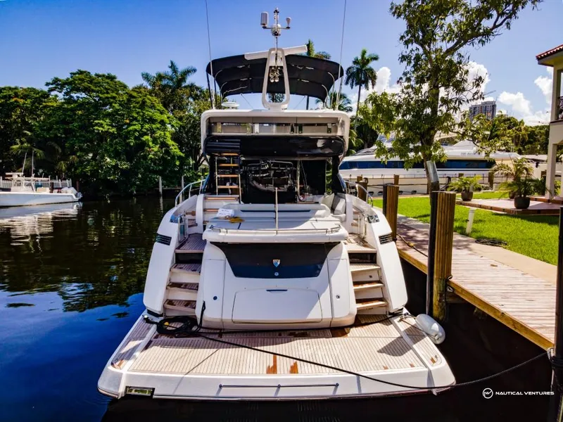 Slide: The Image of 2023 Fairline Phantom 65 yacht docked at a marina. - 33