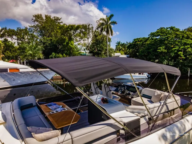 Slide: The Image of 2023 Fairline Phantom 65 luxury yacht with shaded seating area. - 35