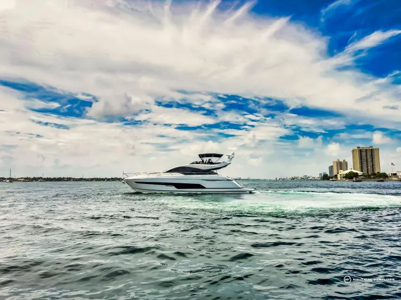 Slide: The Image of 2023 Fairline Phantom 65 yacht cruising on a sunny day. - 7