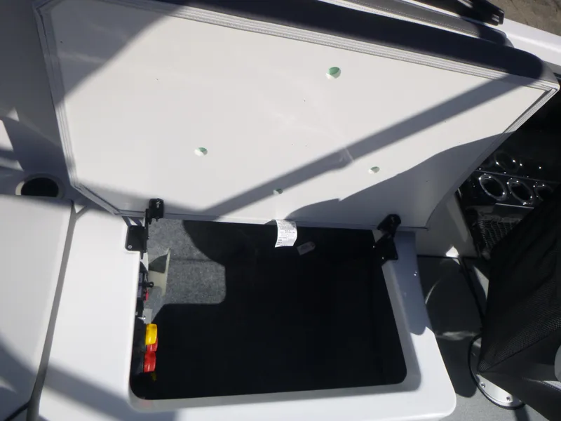 Slide: The Image of Open storage compartment on a 2024 Yamaha Boats AR250. - 14