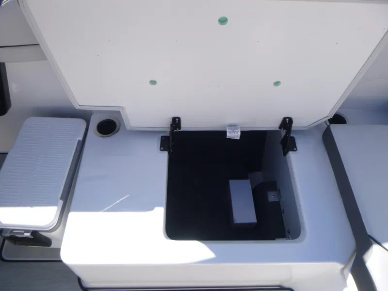 Slide: The Image of Open storage compartment on 2024 Yamaha Boats AR250. - 15