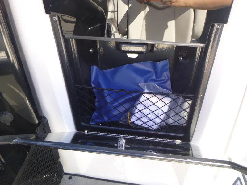 Slide: The Image of Storage compartment on a 2024 Yamaha Boats AR250. - 18