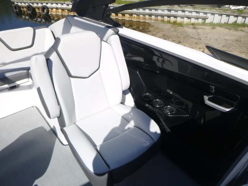 Slide: The Image of 2024 Yamaha Boats AR250 interior seating with cup holders. - 20