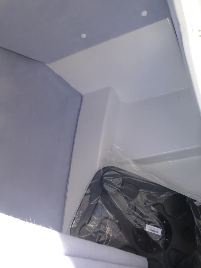 Slide: The Image of Interior storage compartment of 2024 Yamaha Boats AR250. - 25