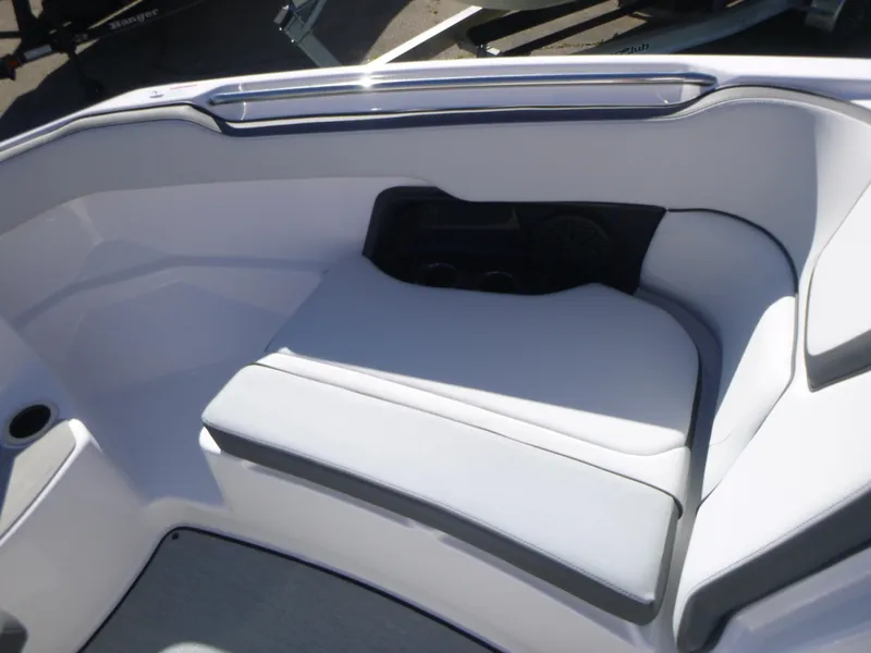 Slide: The Image of 2024 Yamaha Boats AR250 interior seating area with cup holders. - 31