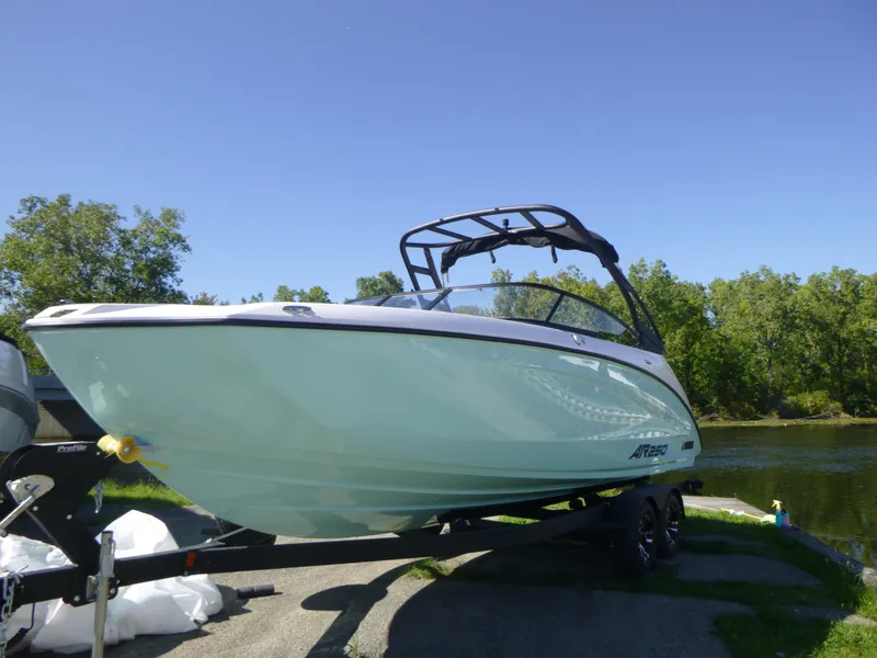 Slide: The Image of 2024 Yamaha Boats AR250 on trailer by a lake. - 40