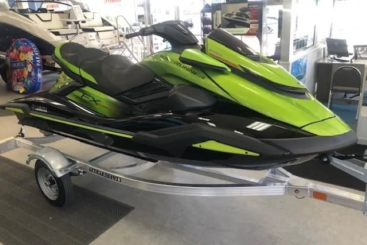Slide: The Image of 2024 Yamaha WaveRunner FX Cruiser SVHO with Audio in lime green and black on trailer. - 0