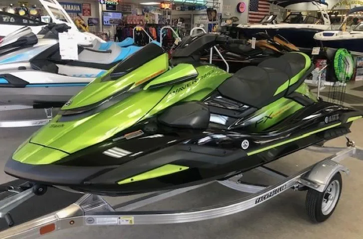Slide: The Image of 2024 Yamaha WaveRunner FX Cruiser SVHO with Audio in showroom, vibrant green and black. - 1