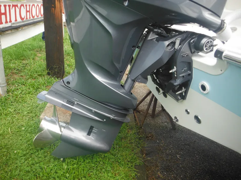 Slide: The Image of 2024 Tidewater 220 LXF boat engine and propeller close-up. - 10