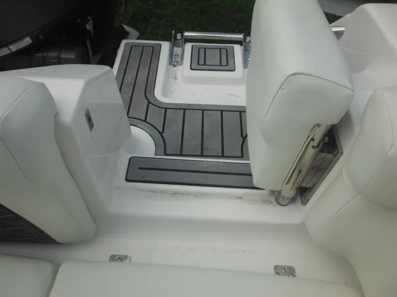 Slide: The Image of 2024 Tidewater 220 LXF boat interior seating and deck area. - 15