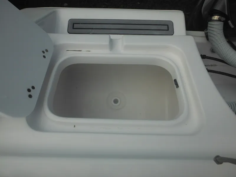 Slide: The Image of 2024 Tidewater 220 LXF boat storage compartment. - 17