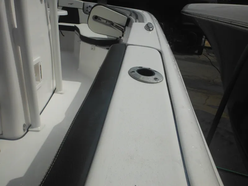 Slide: The Image of 2024 Tidewater 220 LXF boat interior with seating and rod holder. - 27