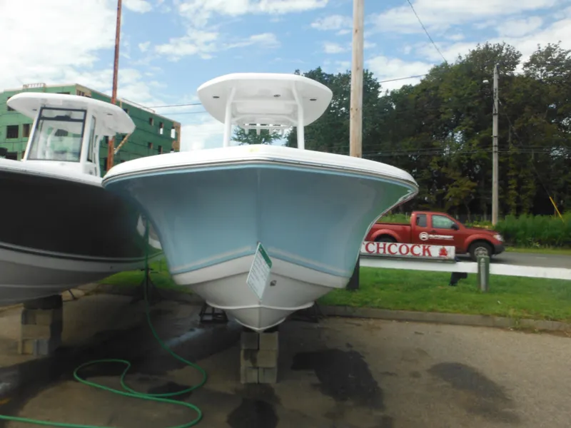 Slide: The Image of 2024 Tidewater 220 LXF boat displayed outdoors. - 3