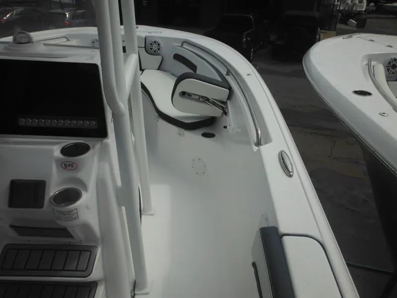 Slide: The Image of 2024 Tidewater 220 LXF boat interior with seating and console. - 32