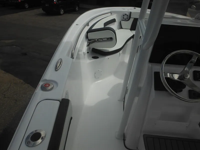 Slide: The Image of 2024 Tidewater 220 LXF boat interior with seating and steering wheel. - 33