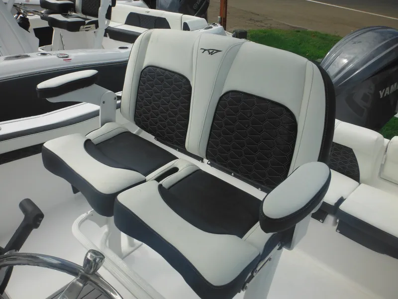 Slide: The Image of 2024 Tidewater 220 LXF boat with dual cushioned seats and armrests. - 35